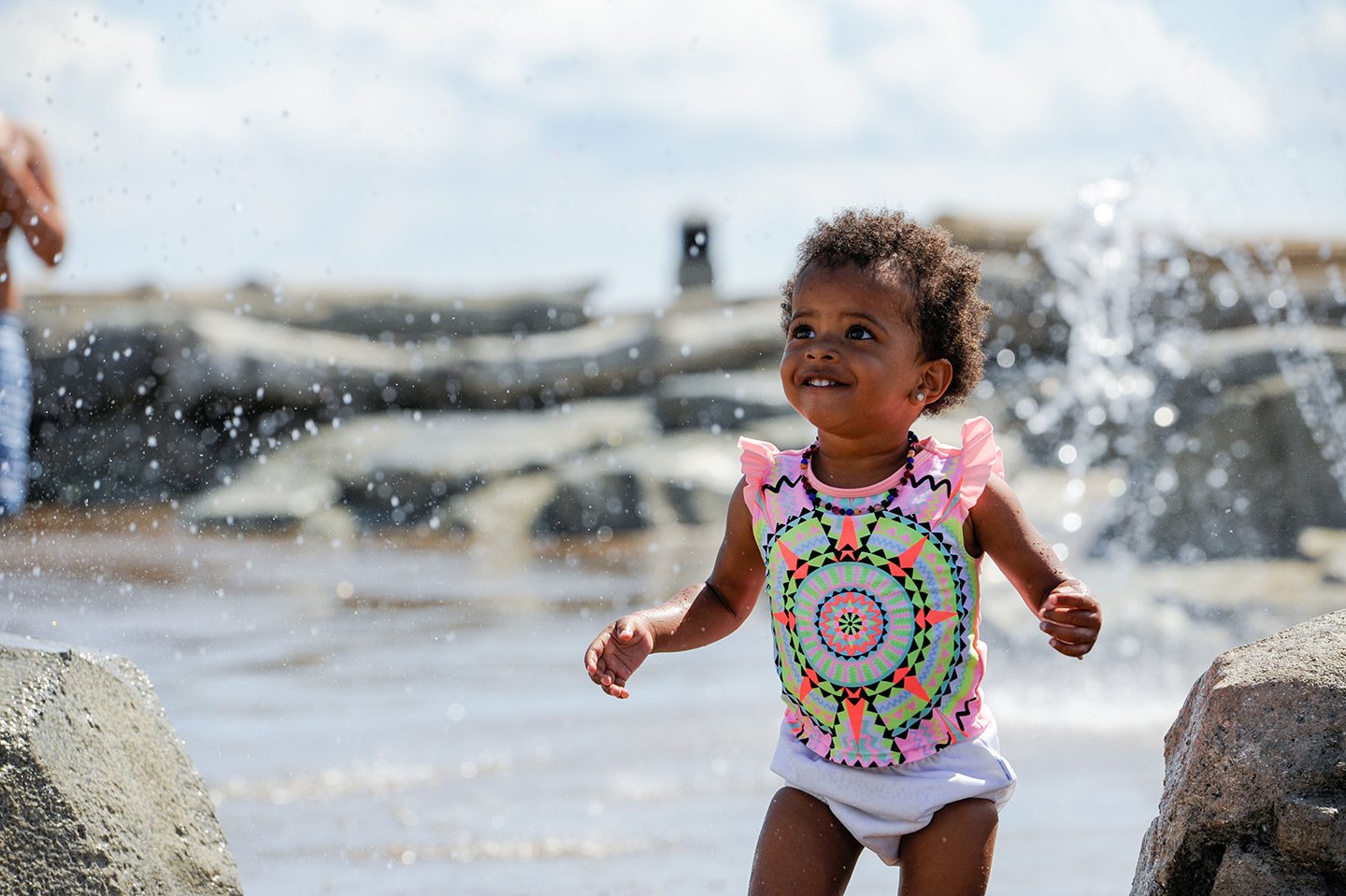Image of child playing at a splash park 