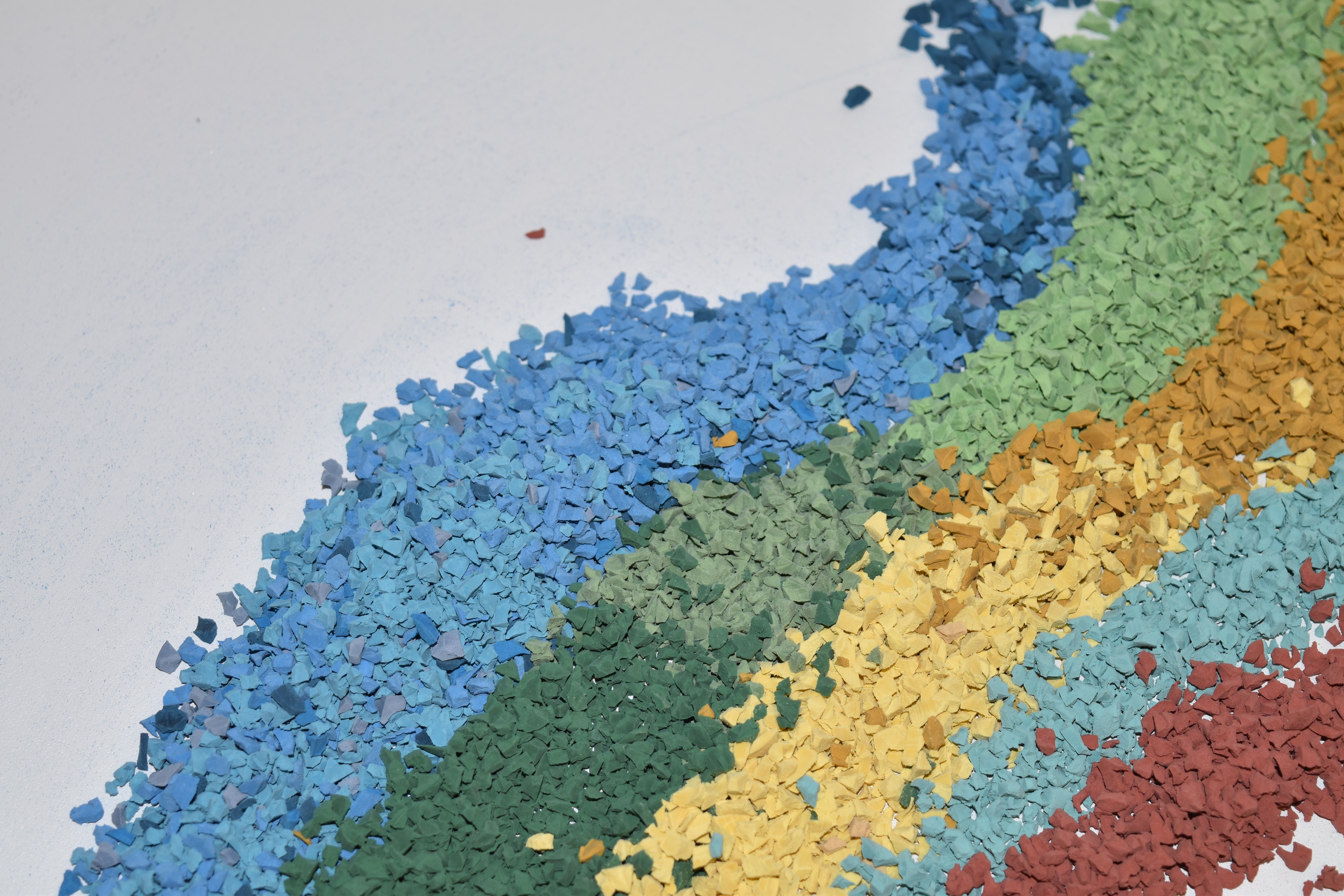 rainbow of colors of rubber granules for surfacing