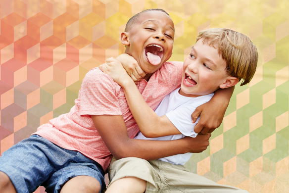 Two children hugging each other with both of their mouths open