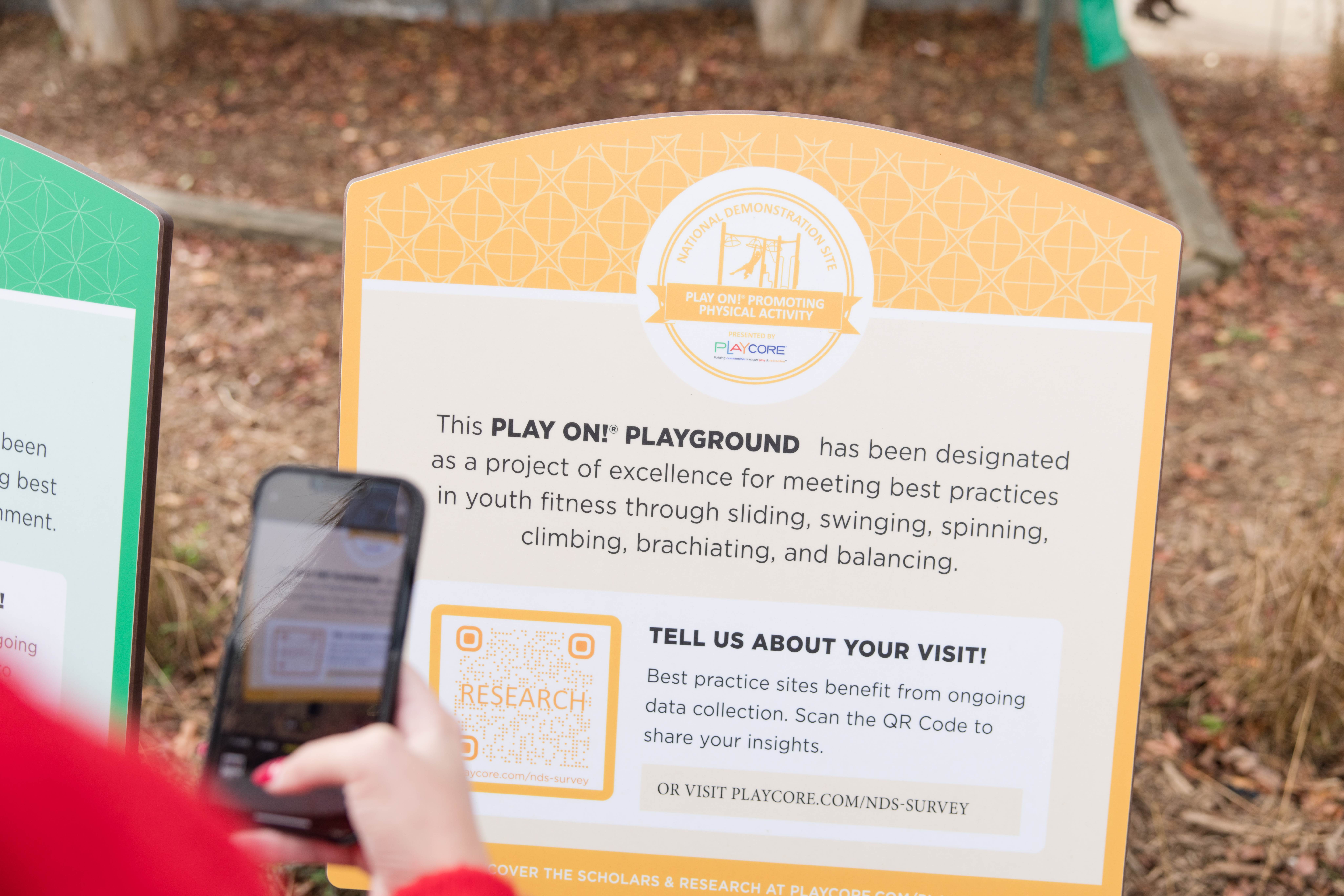 Phone with camera out to grab QR code for Play On! survey