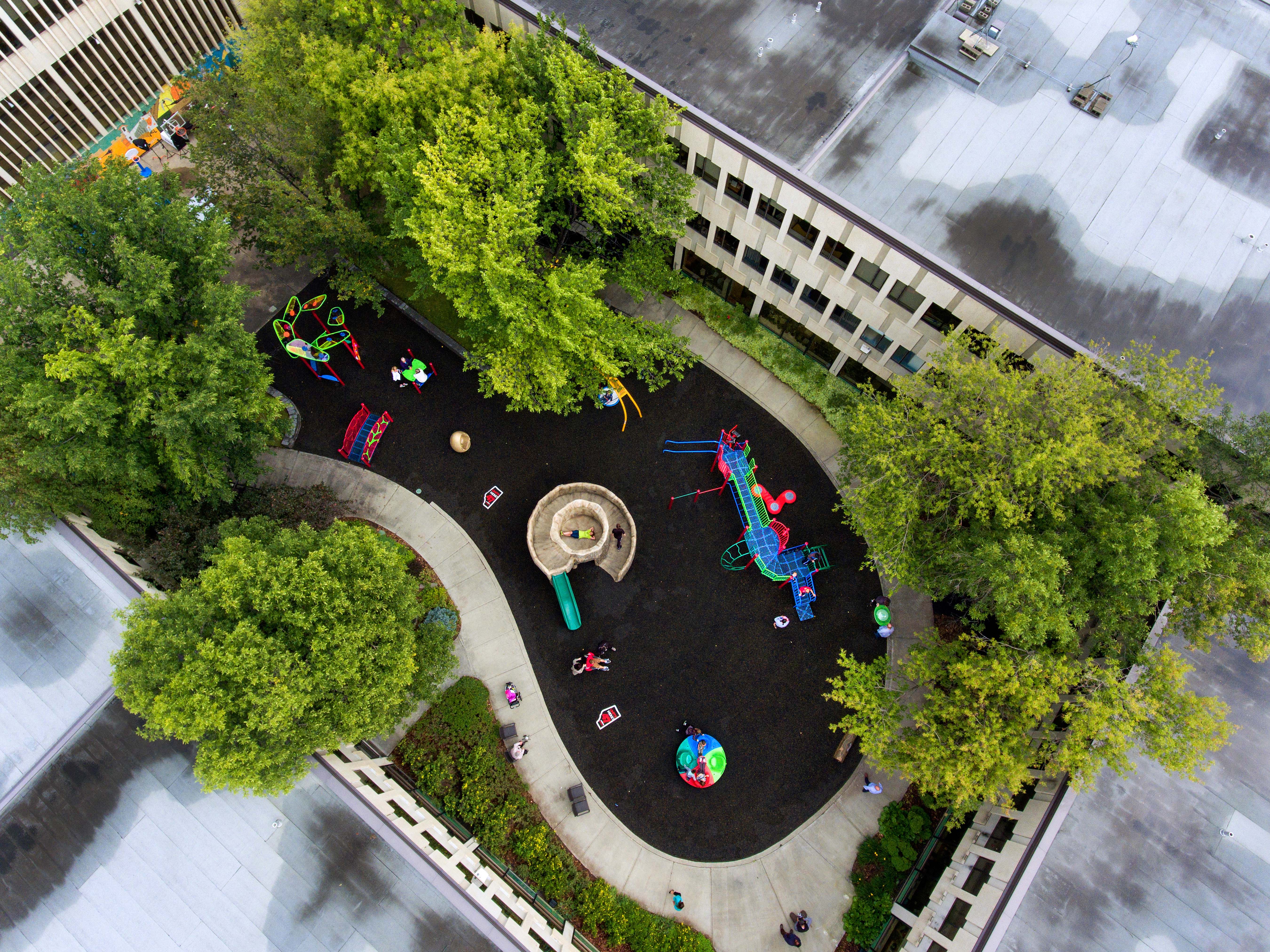 A birds-eye view of a playground in a hospital courtyard
