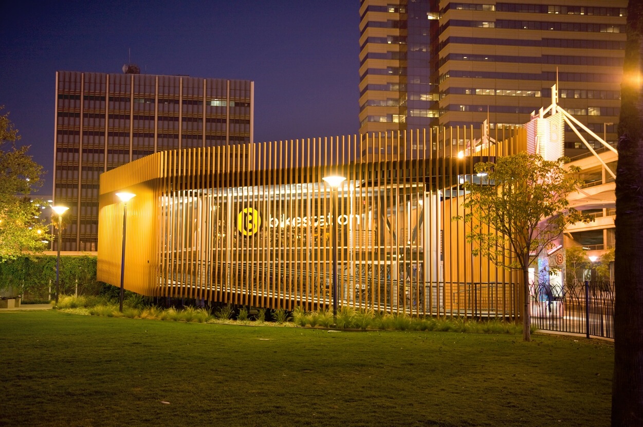 The long beach bike station illuminated at night