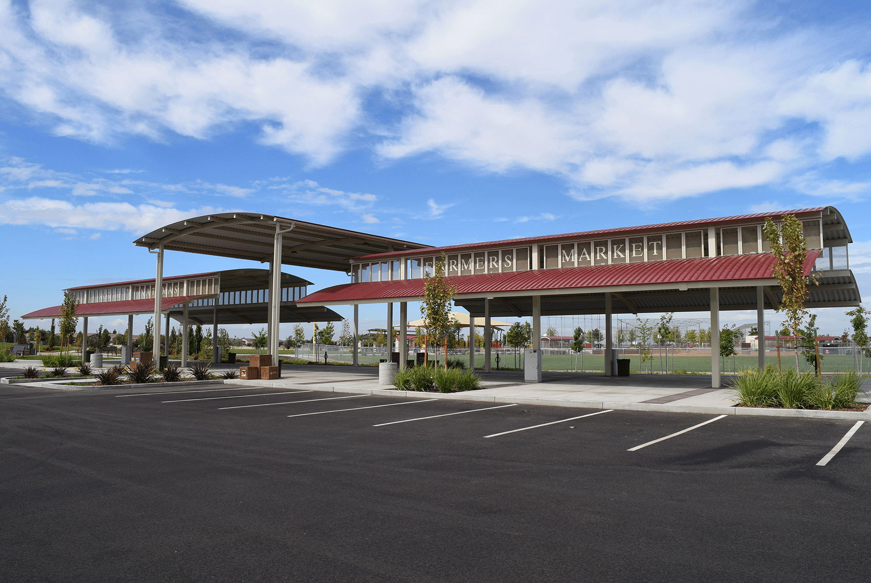 A large covered two-tiered pavilion for a farmers market